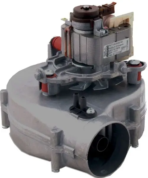 Abgasventilator von Wolf, montiert auf einer flachen Basis mit mehreren Anschlüssen. sichtbar sind ein Motor und Ventilatorblätter für den Luftstrom.